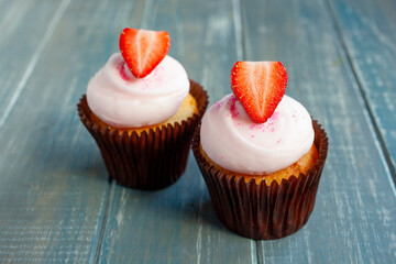 Strawberry Cupcakes with Pink Icing and Fresh Strawberry