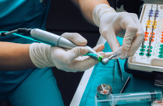Dentist prepares  instruments and tools for operation 