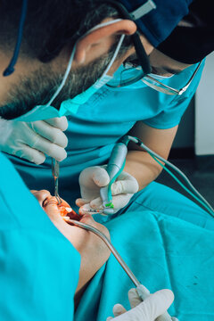 Putting implants during surgery in dental clinic