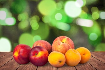 Tasty sweet fresh ripe peaches on a wooden table