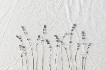 Lavender flowers arranged on linen cloth.