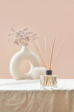 Aroma diffuser with clay vase with flowers.
