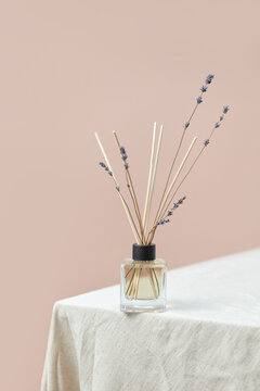Aroma diffuser with sticking out lavender branches.