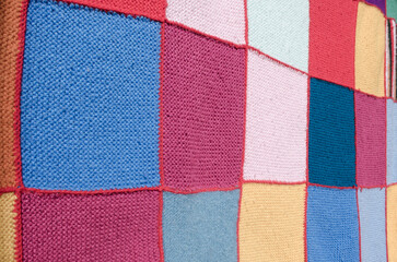 Colorful crochet wool blanket. Squares pattern.