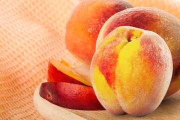 Fototapeta na wymiar Tasty sweet fresh ripe peaches on a wooden table