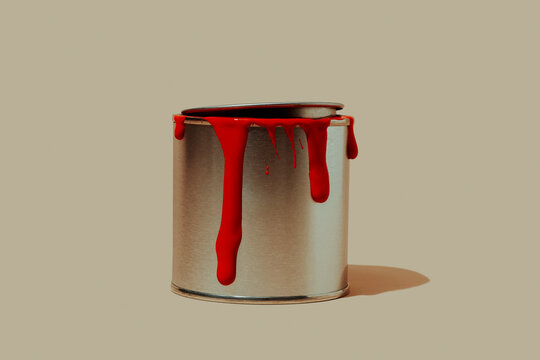 paint can with stains of red paint