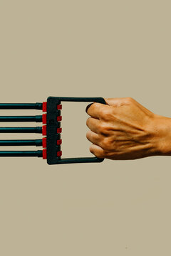 man uses a fitness expander