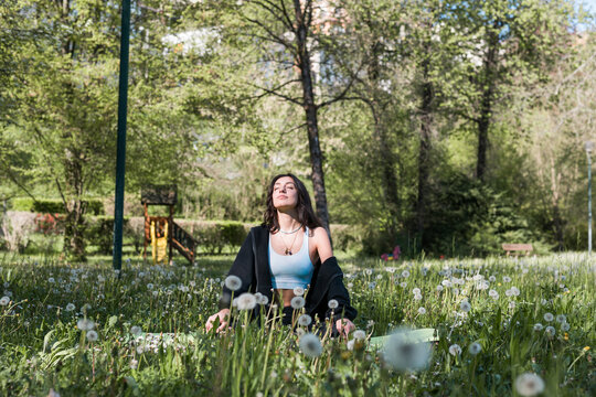 Girl Doing Meditation In A Park