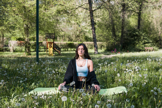 Girl Doing Meditation In A Park