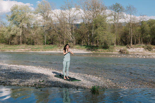 Girl Doing Yoga In The River