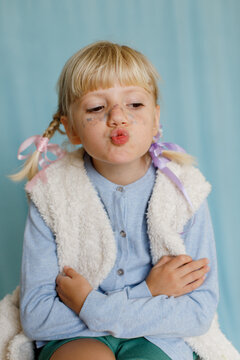 A girl with lips in a round form indoors