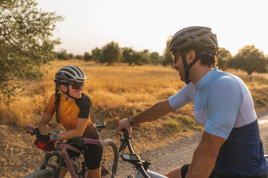 Two mountain bikers between wheat fields