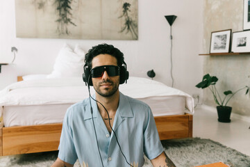 Young Man Using Brain Machine to Optimize Brain Function