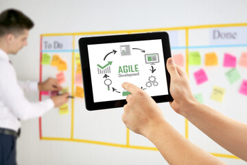 Man with tablet PC in office. Agile concept