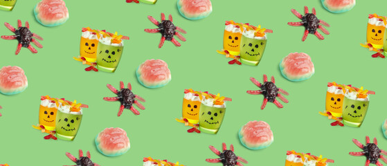Different scary desserts for Halloween on green background
