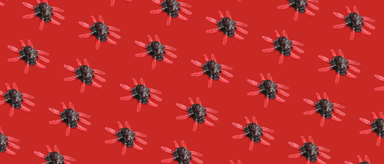 Tasty creepy candies for Halloween on red background