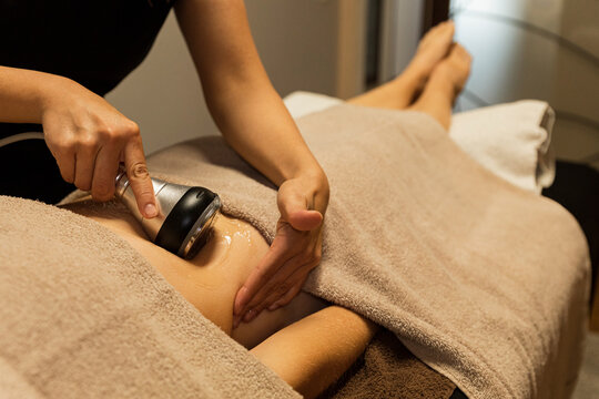 Woman receiving a cavitation massage  therapy