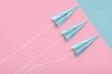 Fototapeta premium Paper planes on color background, top view