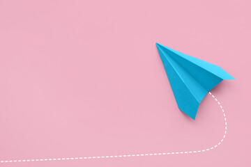 Paper plane on pink background