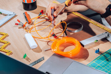 Technician working on wires and cables.