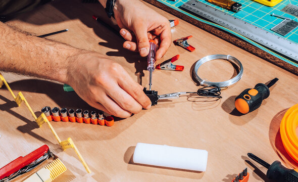 Technician working on wires and cables.