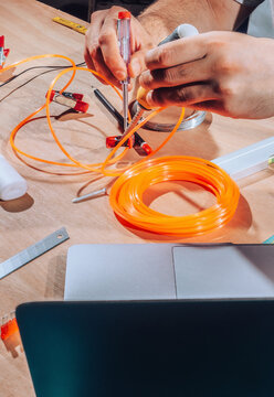 Technician working on wires and cables.