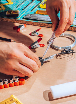 Technician working on wires and cables.