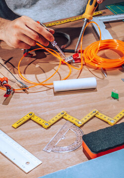Technician working on wires and cables.