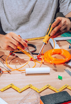 Technician working on wires and cables.