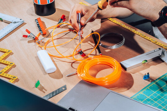 Technician working on wires and cables.