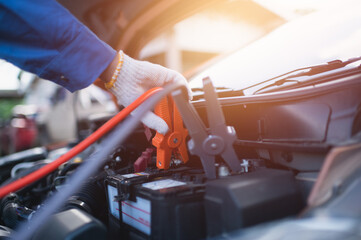 Close Up hands of a car mechanic working in a car repair or check service