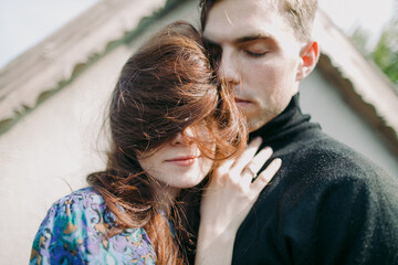 close up portrait of a young couple embracing