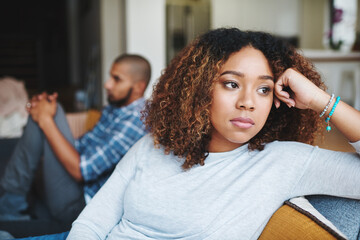 Unhappy couple and sad woman upset after argument or conflict with her man on home sofa. Angry...