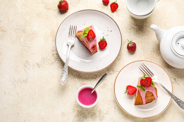 Composition with plates of tasty strawberry cake and sauce on light background