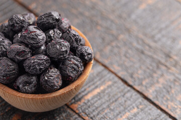 Freeze Dried Blueberries Isolated on a Dark Wooden Table