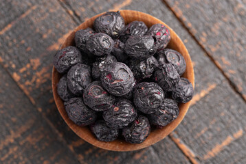 Freeze Dried Blueberries Isolated on a Dark Wooden Table