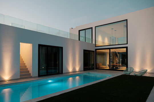 Luxury home with pool at night