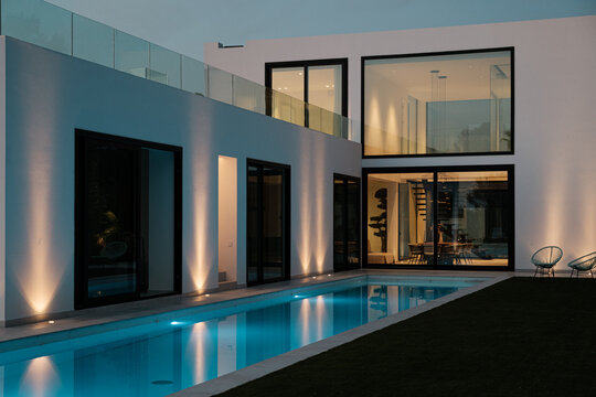 Luxury architecture with pool lighted at night