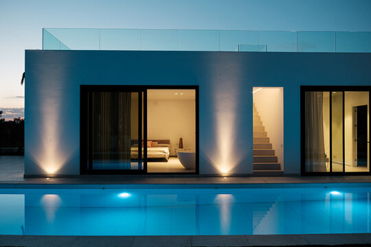 Modern villa lighted at night