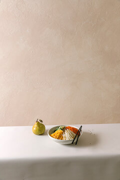 Bowl of noodles with pear