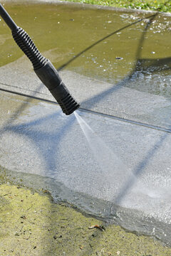 Power Washing Backyard Concrete