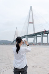Asian women travel and take photos in Shantou