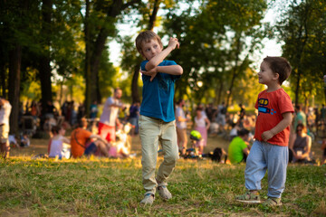Kids dancing funny, play in a park