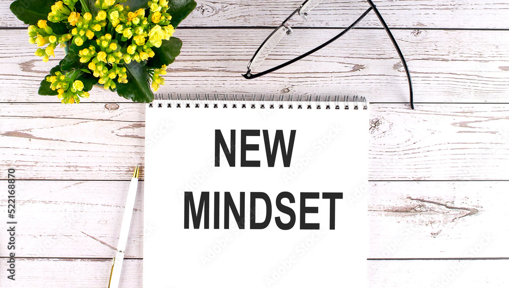 Poster new mindset text concept write on notebook on wooden background