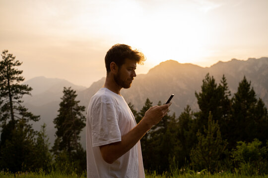 Man using phone in nature