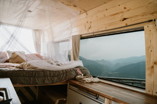 Camper van indoors with bed 