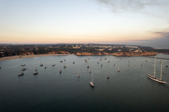Yachts floating on sea under sundown sky in Portugal