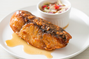 fried snapper fish with fish sauce and spicy salad