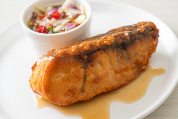 fried snapper fish with fish sauce and spicy salad