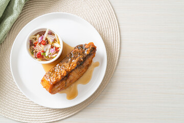 fried snapper fish with fish sauce and spicy salad